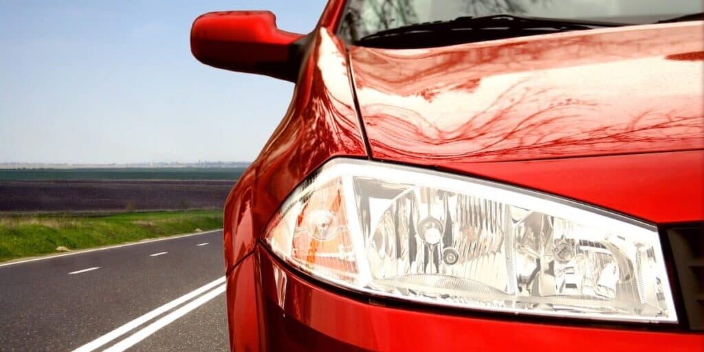 Green Sport car on a highway